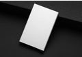 Aluminium geometric business card holder in metallic colours on desk