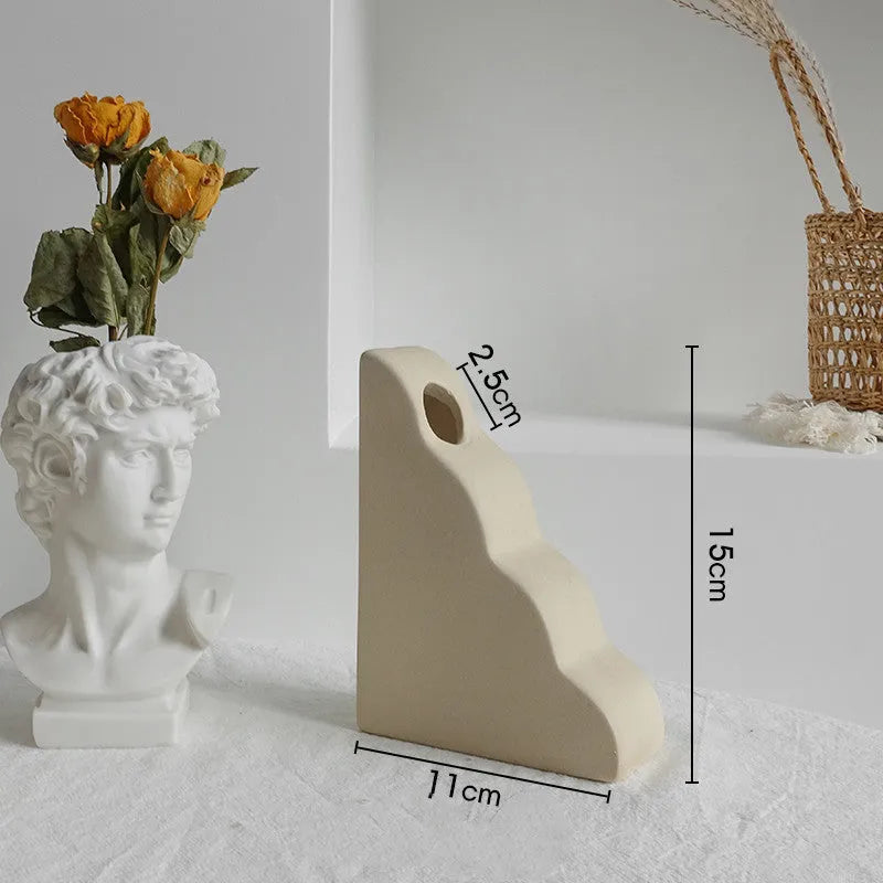 Matte finish unglazed ceramic vase for dry flower arrangements in a Nordic style.