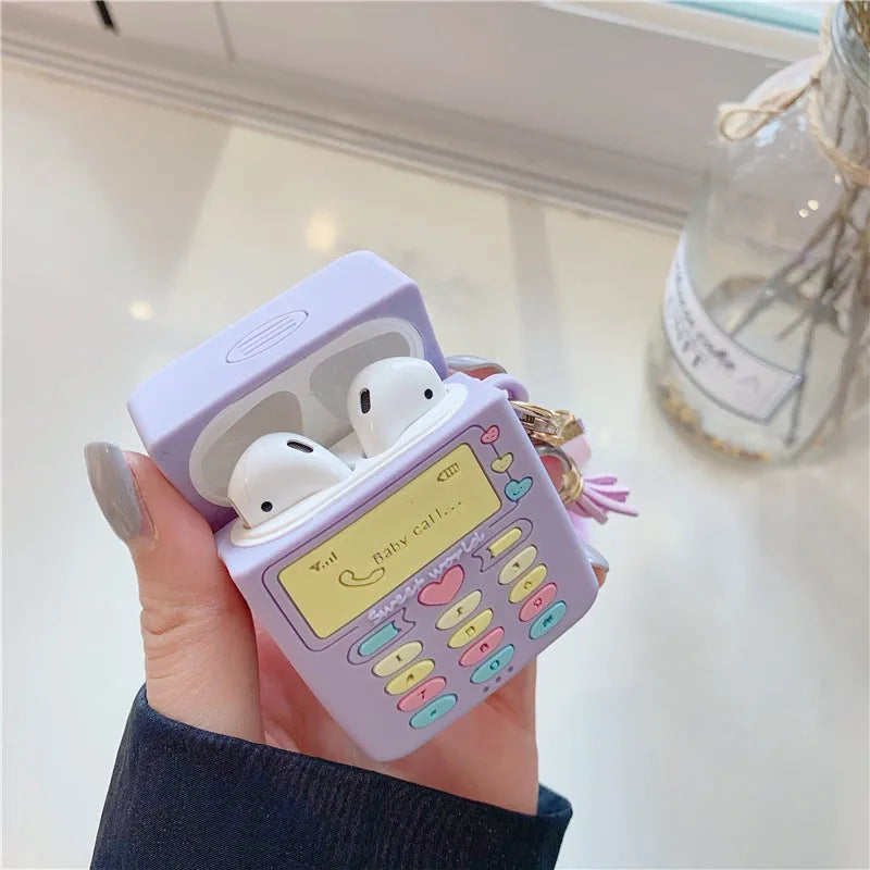 Purple silicone protective case for Apple AirPods with a small white fur ball pendant attached.