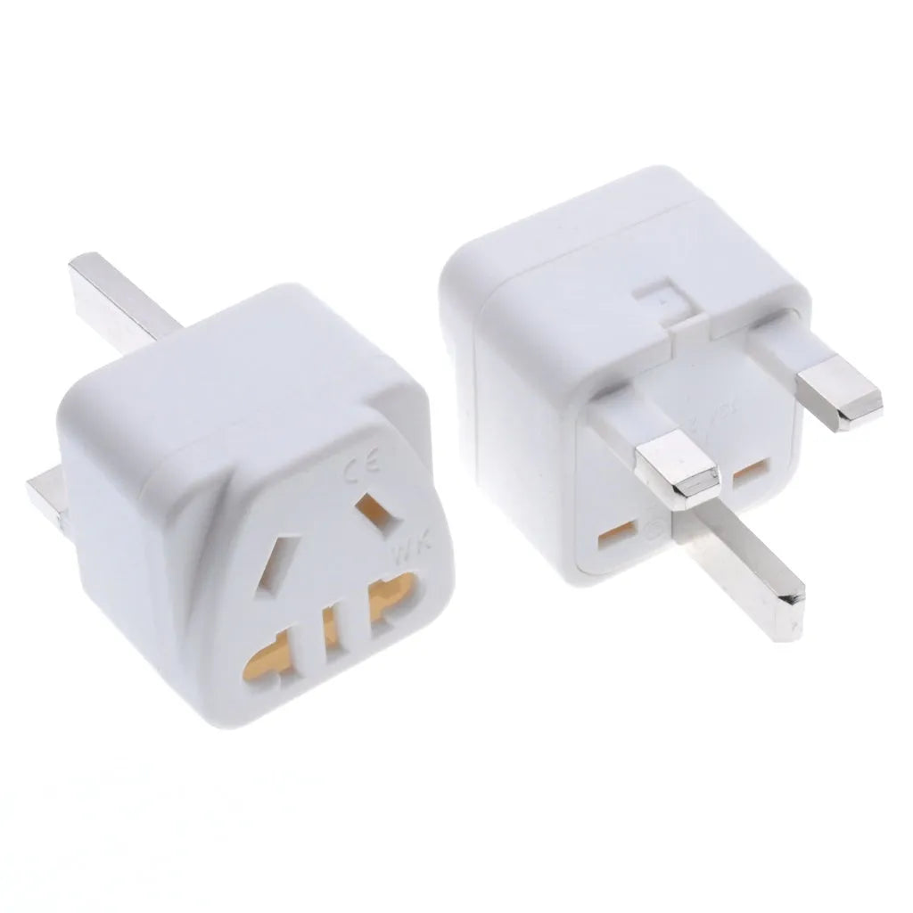 Square white UK to international power adapter with five sockets and a grounded three-pin plug.