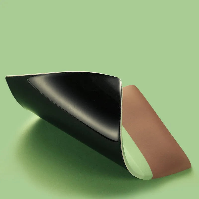 Thick grey wrist support mouse pad with a cute printed design, showing its 20mm elevated rest.