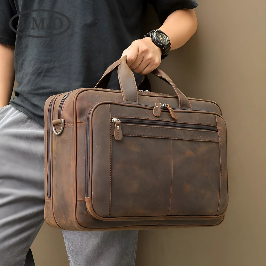 Men's dark brown Crazy Horse leather laptop bag, 43x15x30.5cm, with hard handle and zipper pockets.