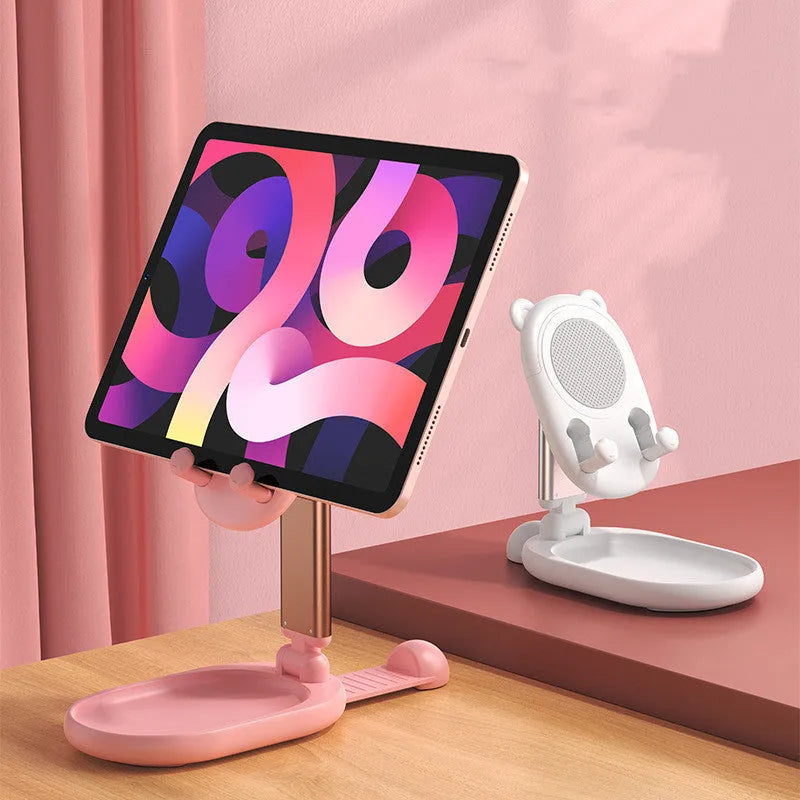 Blue adjustable aluminium and PC phone tablet stand with mirror on a wooden desk.