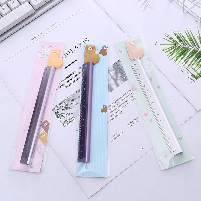 Alpaca pattern printed aluminium ruler with centimetre scale and non-slip rubber strip, 30 cm long.