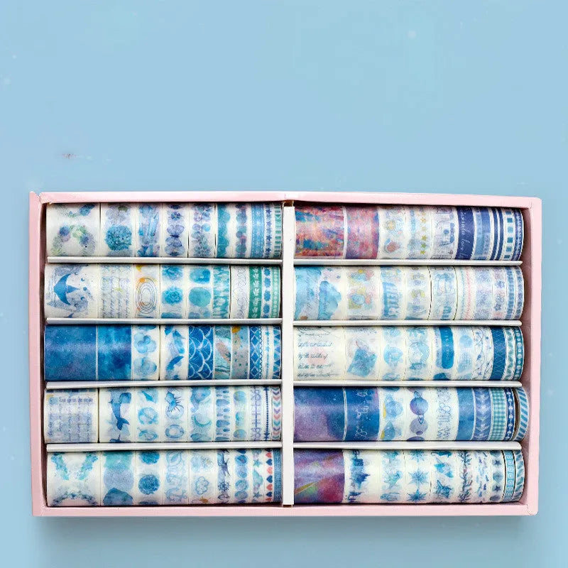 100 rolls of antique character printed hand account tape in a box showing multiple widths and colours