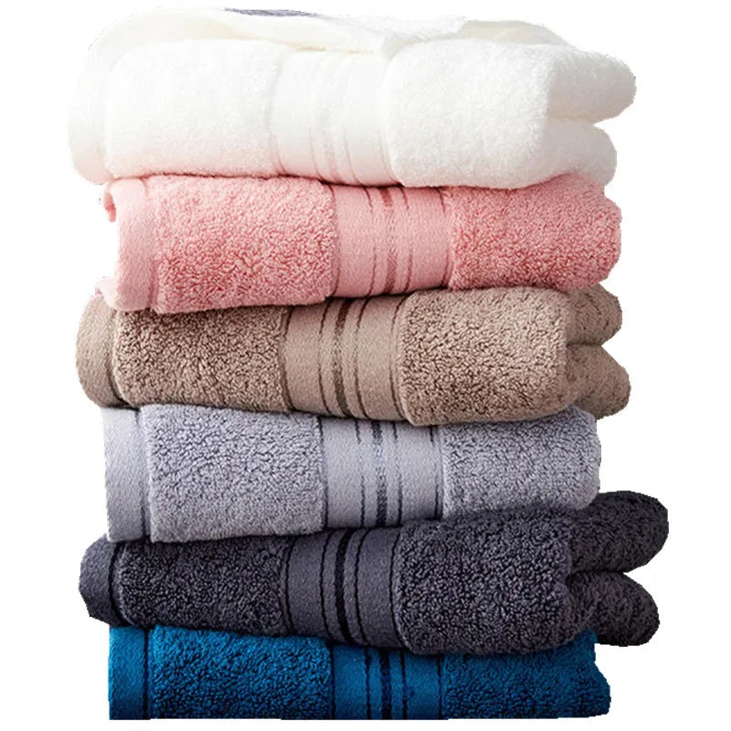 Three-piece pure cotton towel set in floral colours showing bath towel, towel, and small square scarf