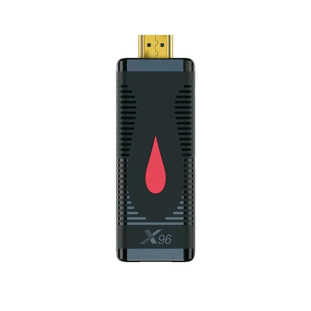 Small black Android TV set-top box dongle with remote control, power supply, and HDMI cable.