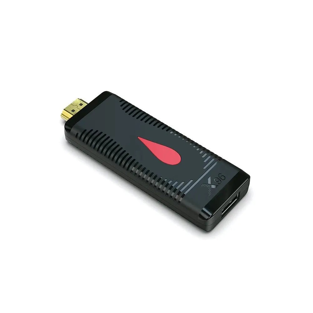 Small black Android TV set-top box dongle with remote control, power supply, and HDMI cable.