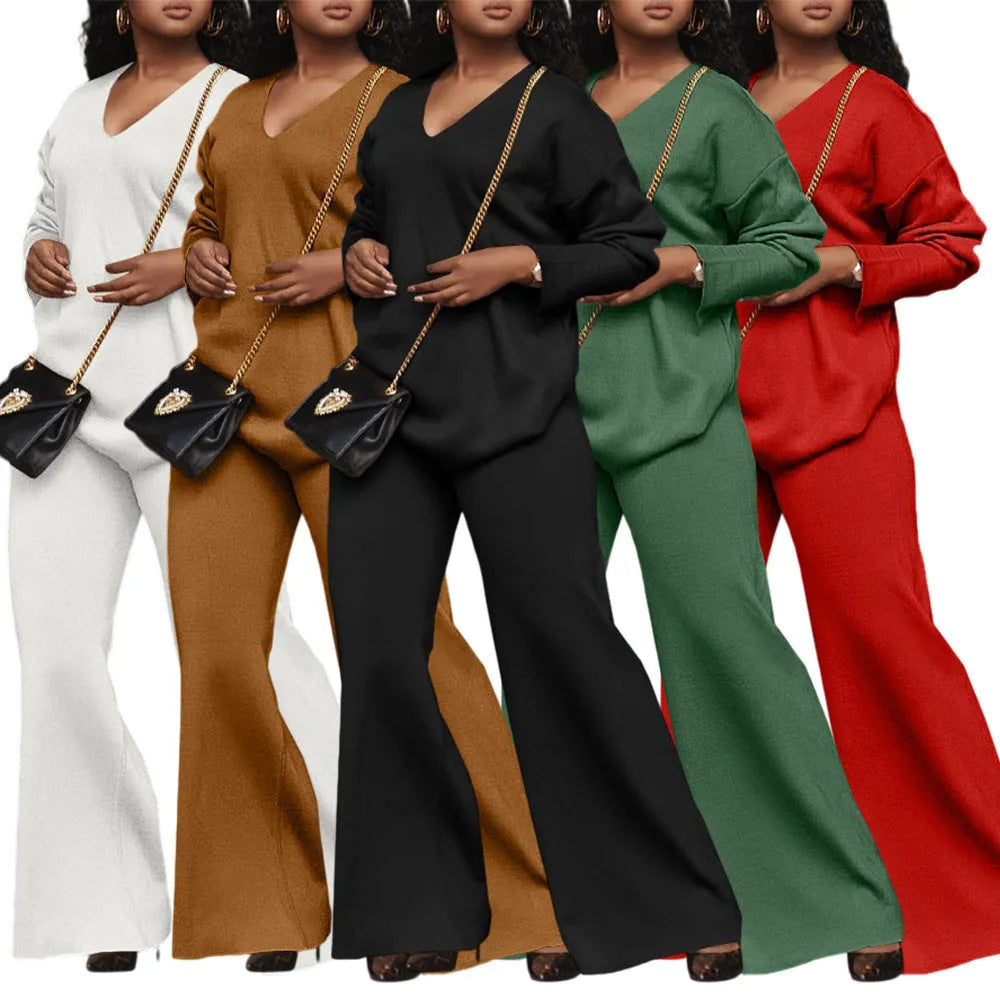 Women's brown thick suede two-piece suit with long sleeves and trousers, laid flat.