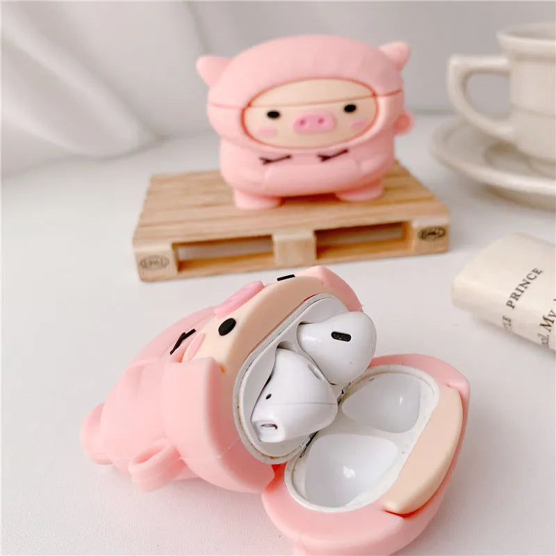 Pink cartoon pig silicone flip case with hook for Apple AirPods 1, 2, and Pro earphones.