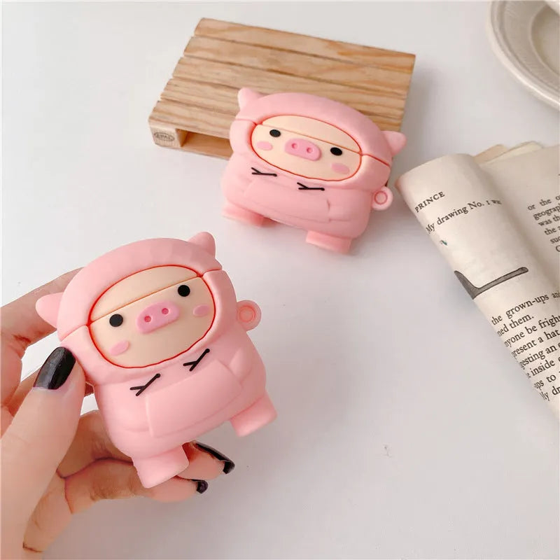 Pink cartoon pig silicone flip case with hook for Apple AirPods 1, 2, and Pro earphones.