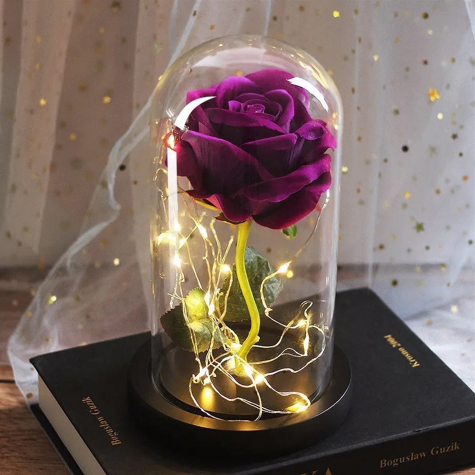 Immortal simulation rose bouquet in glass cover with warm LED light on a tabletop