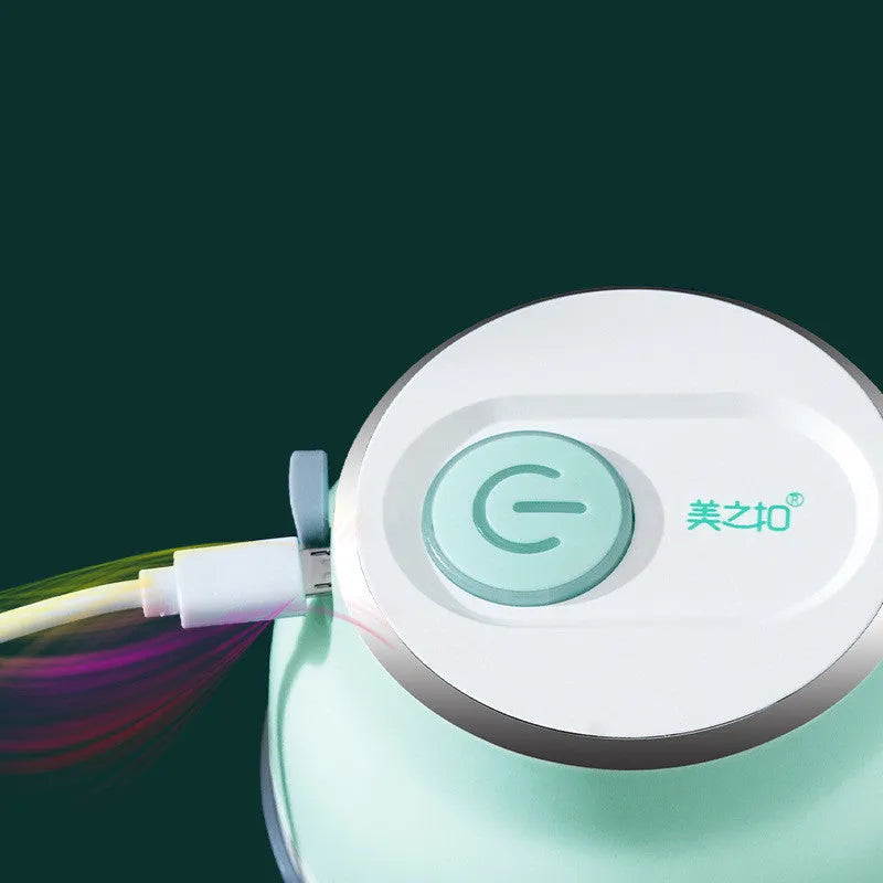 Portable USB electric food chopper with transparent cup and stainless steel blade.