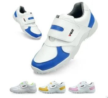 Children's breathable sports shoes in blue with Velcro closure and non-slip rubber outsole on green grass
