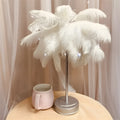 Remote control feather table lamp with warm white light, iron shell, pink feather style on bedside table