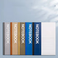 Stack of A4 A5 B5 32K notebooks with smooth thick paper, dark and light covers, 30 to 100 pages.