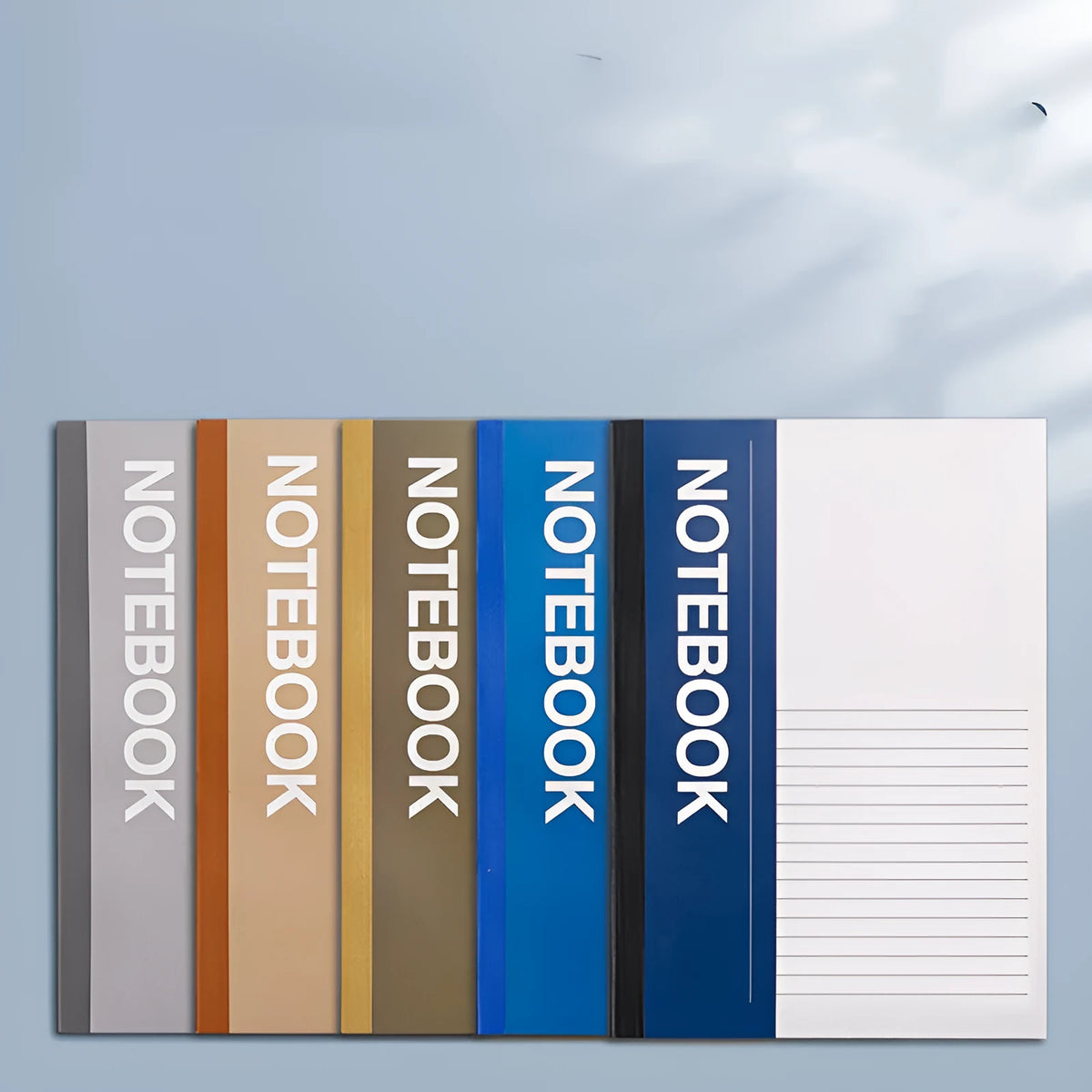 Stack of A4 A5 B5 32K notebooks with smooth thick paper, dark and light covers, 30 to 100 pages.