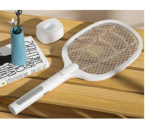 Rechargeable electric mosquito swatter with metal grid, USB charging cable, and charger base.