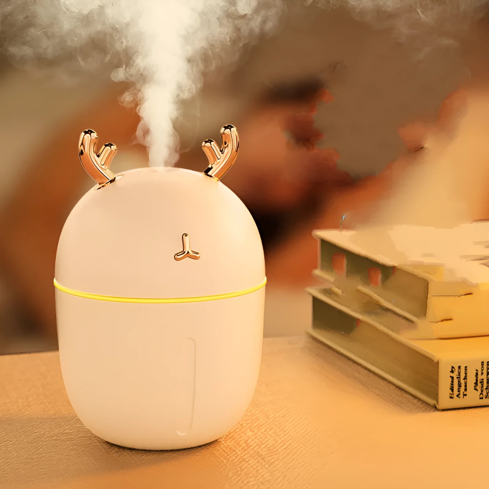 USB mini humidifier cute pet style 84x84x127mm in blue on a desk with USB cable