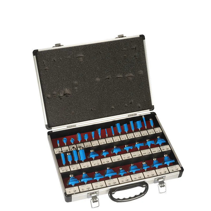 A set of 35 metal woodworking milling cutters and side cutters with different coloured handles on a workbench.