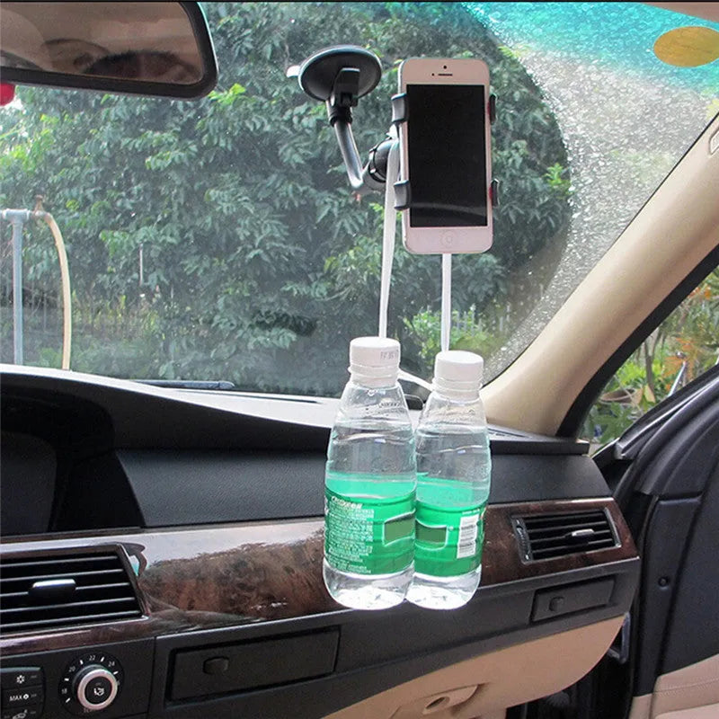 Black car phone holder with suction cup attached to windshield showing 360-degree rotation and device clamp