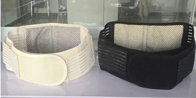 Black self-heating magnetic waist support belt laid flat, showing elastic cloth material and adjustable fit.