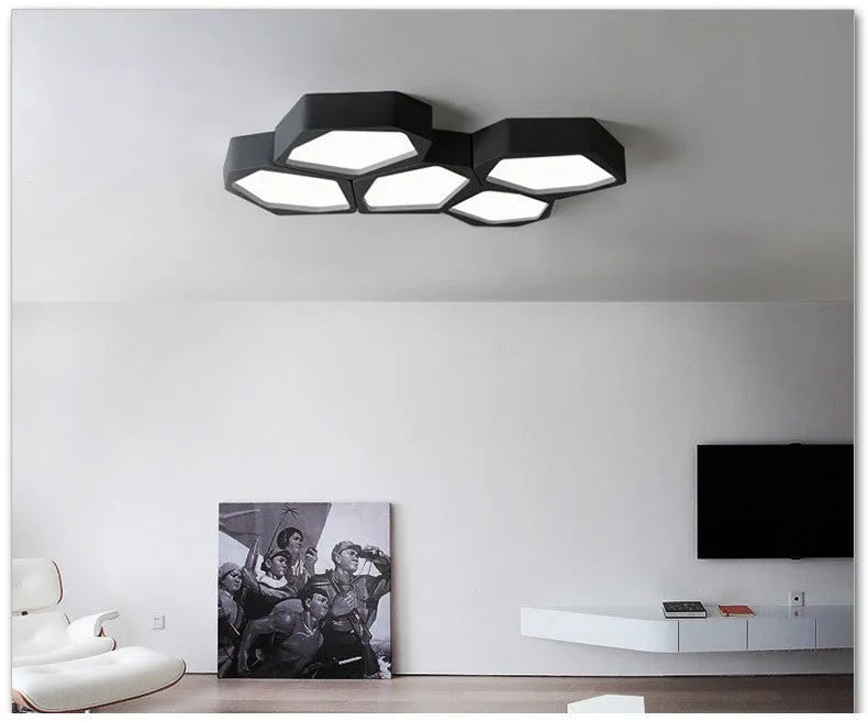 Geometric shaped wall light with black or white iron frame and push-button control.