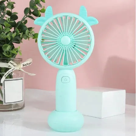 Small handheld USB rechargeable fan in blue, green, pink, or yellow colour options.