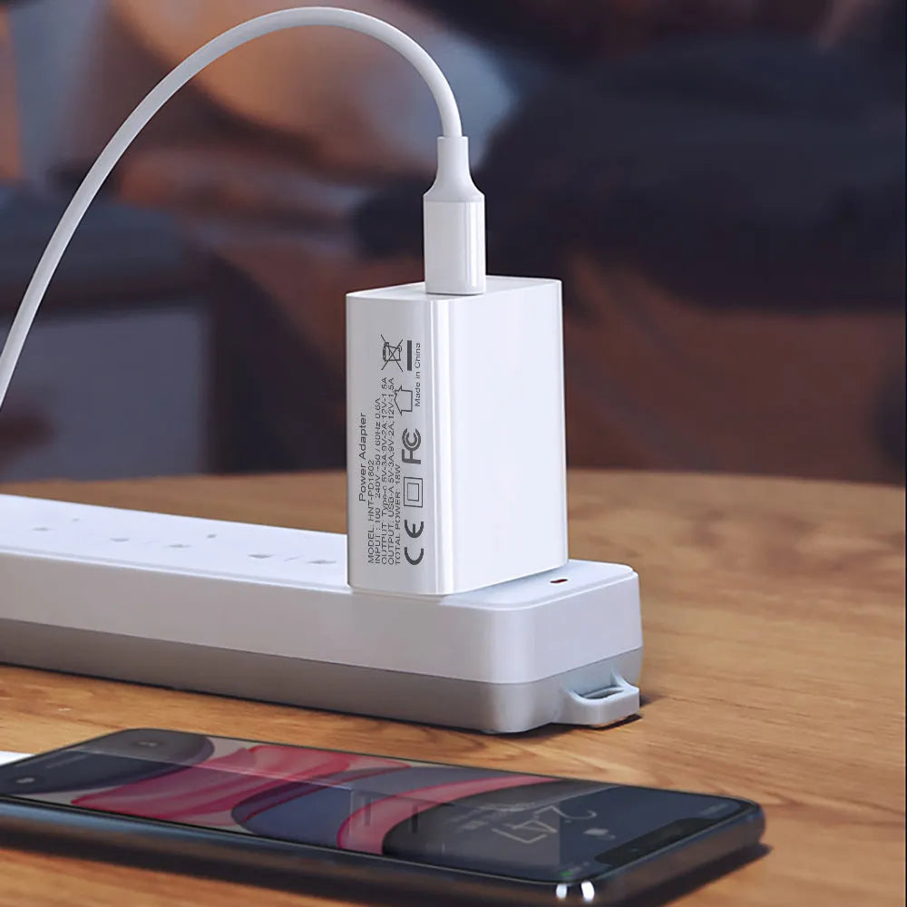 White 18W fast charging plug with dual USB ports and UK British standard wall plug