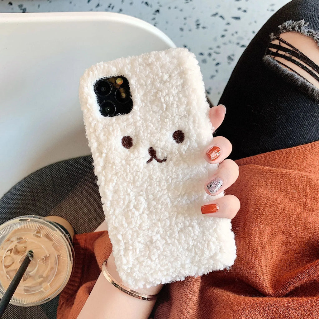 Brown plush bear embroidered iPhone case on a mobile phone