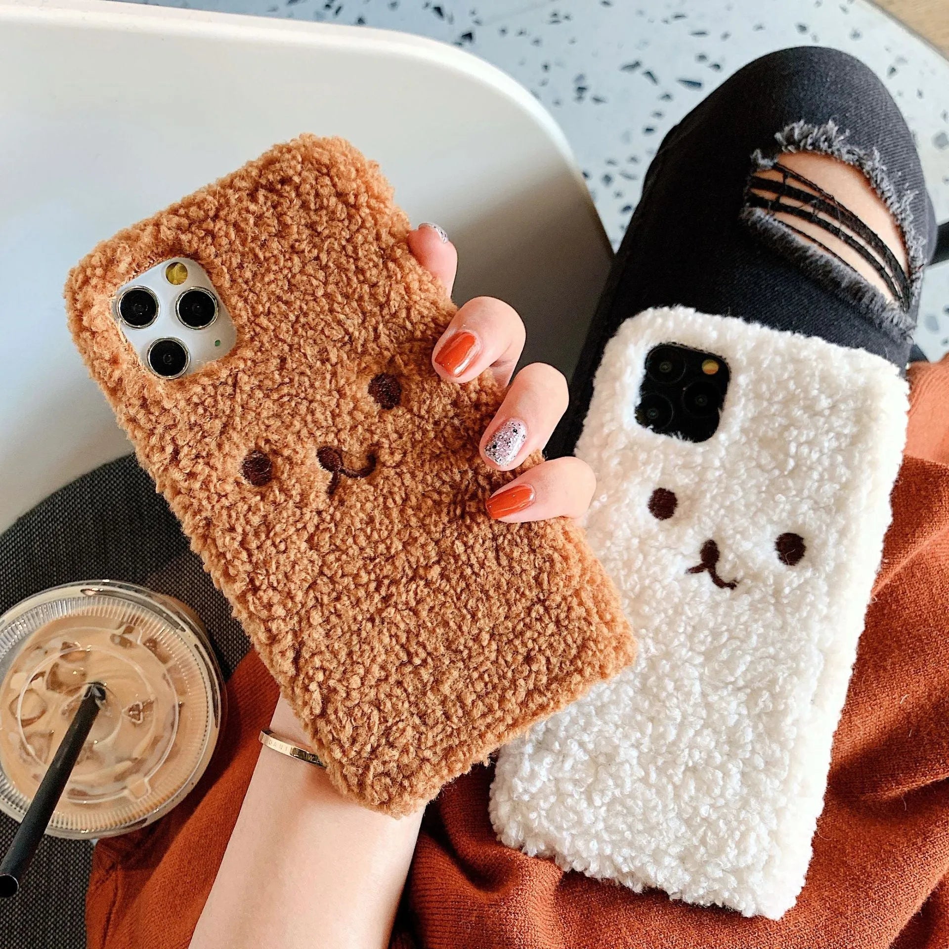 Brown plush bear embroidered iPhone case on a mobile phone