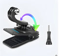 Black 360-degree rotating backpack clip mount for GoPro and action cameras, showing clamp and adjustable head.