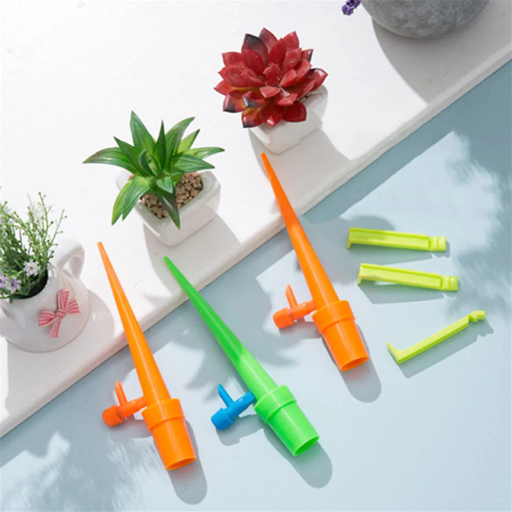 Plastic plant watering spikes 16.5cm x 3cm in green and orange for garden and potted plants