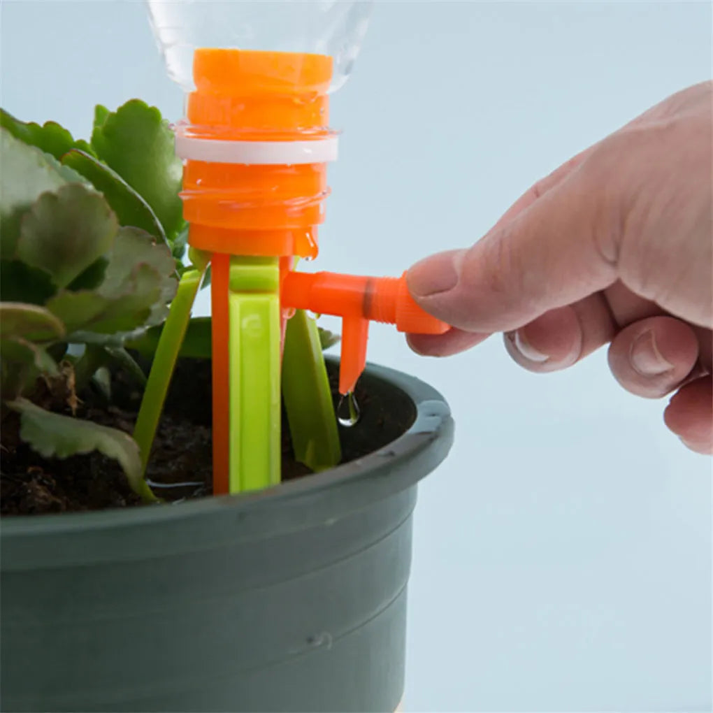 Plastic plant watering spikes 16.5cm x 3cm in green and orange for garden and potted plants