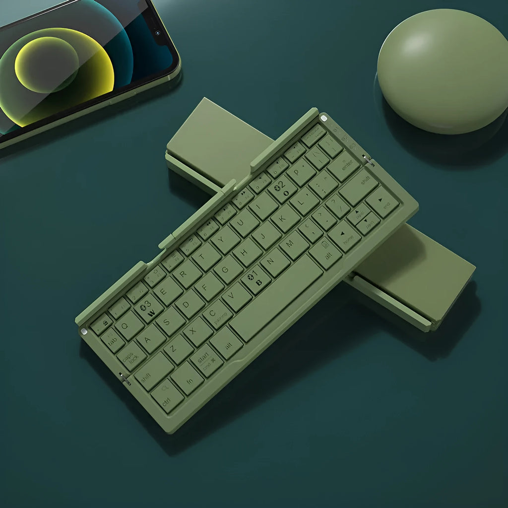 Silver aluminium foldable Bluetooth keyboard with stand holding smartphone