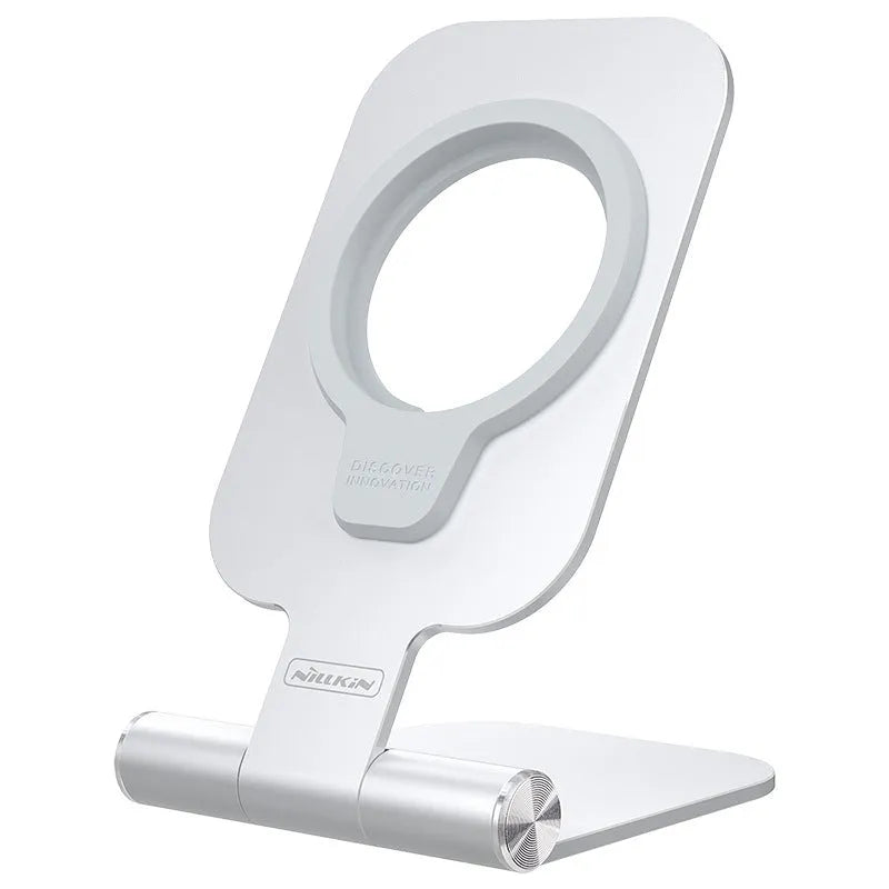 Silver NILLKIN foldable aluminium alloy magnetic wireless charging stand for iPhone 12 Mini on a desk