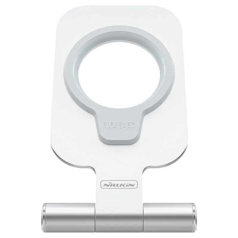 Silver NILLKIN foldable aluminium alloy magnetic wireless charging stand for iPhone 12 Mini on a desk
