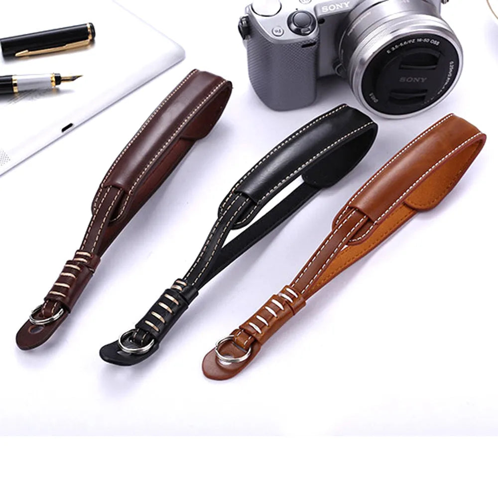 Black and brown universal camera wrist strap for SLR and mirrorless cameras with quick-release mechanism
