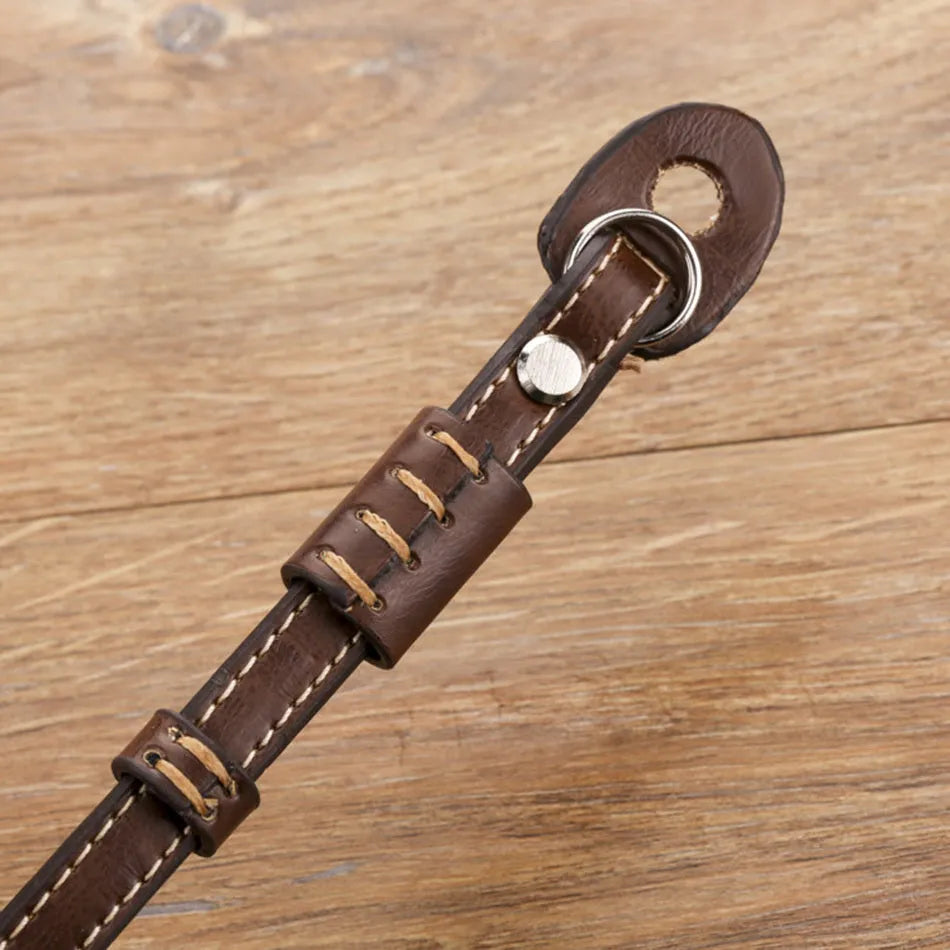 Black and brown universal camera wrist strap for SLR and mirrorless cameras with quick-release mechanism