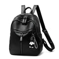 Black soft-surface PU leather backpack with double straps, shown with a pendant option.
