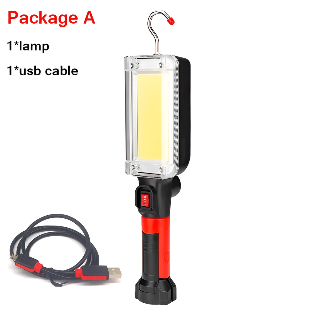 Red portable USB rechargeable COB camping lamp with magnetic hook on a metal surface.