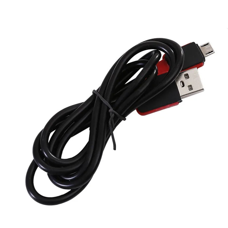 Red portable USB rechargeable COB camping lamp with magnetic hook on a metal surface.