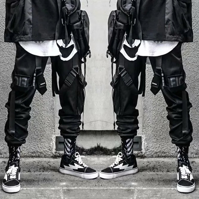 Black functional overalls for men with loose paratrooper-style fit and straight trousers, front view