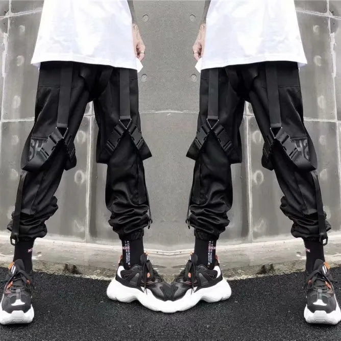 Black functional overalls for men with loose paratrooper-style fit and straight trousers, front view
