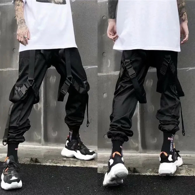 Black functional overalls for men with loose paratrooper-style fit and straight trousers, front view