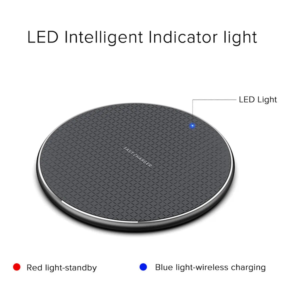 Round black wireless phone charger with aluminum base and Qi receiver on grey surface