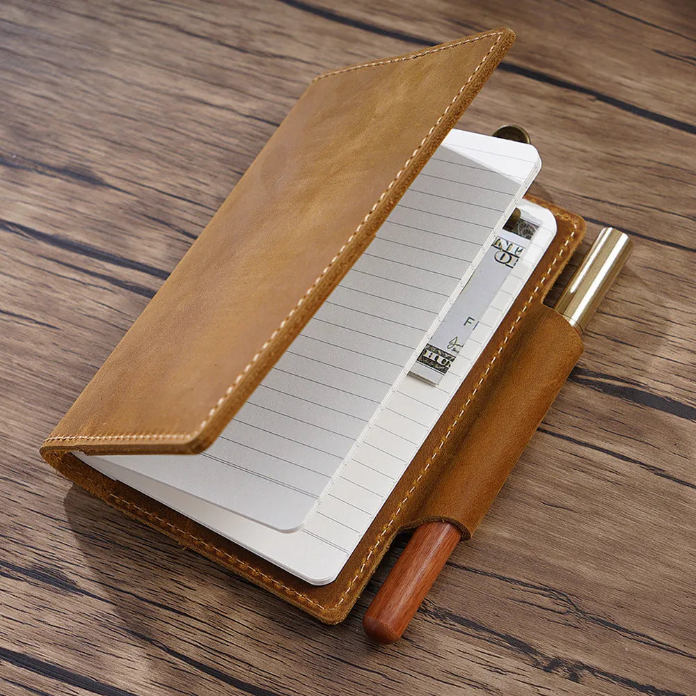 Leather travel notebook with Crazy Horse Yellow Brown cover, open to blank Daolin paper pages, A6 size 9x14cm