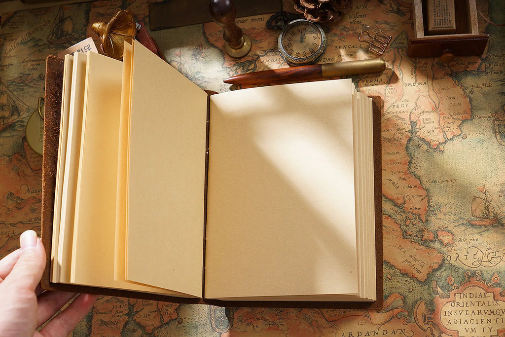 Leather travel notebook with Crazy Horse Yellow Brown cover, open to blank Daolin paper pages, A6 size 9x14cm