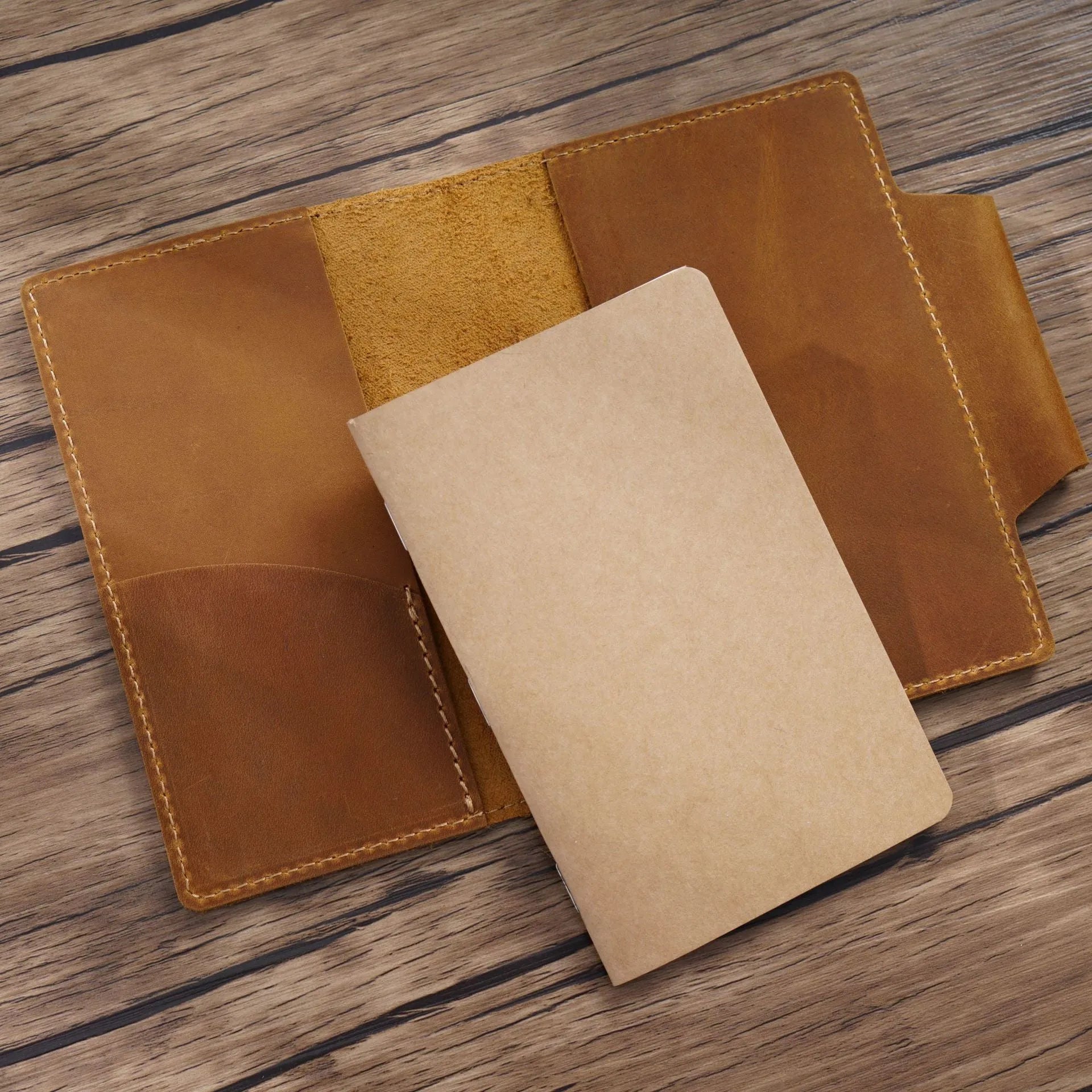 Leather travel notebook with Crazy Horse Yellow Brown cover, open to blank Daolin paper pages, A6 size 9x14cm