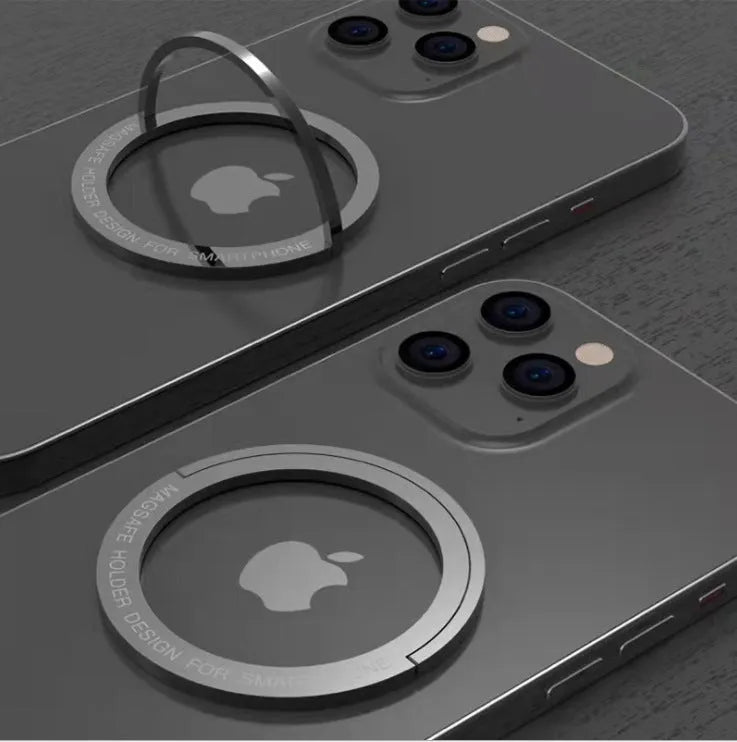 Portable round zinc alloy mobile phone holder in black on a desk for wireless charging